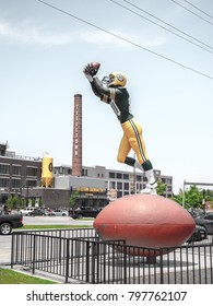 Green Bay - June 3rd 2017:  A Larger Than Life 22 Foot Tall Statue Of Donald Driver Extends His Arm Upward To Catch A Pass In Front Of The Famous Titletown Brewery In Green Bay Wisconsin.