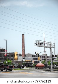 Green Bay - June 3rd 2017:  A Larger Than Life 22 Foot Tall Statue Of Donald Driver Extends His Arm Upward To Catch A Pass In Front Of The Famous Titletown Brewery In Green Bay Wisconsin.