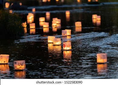 Green Bay, Wisconsin / USA - August 18, 2019 Water Lantern Festival held their event in Green Bay at Pamperin Park, many attendees designed their water lantern to be sent down stream. 