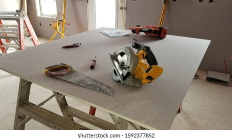 Green Bay, Wisconsin / USA - December 17 2019: Here Is A Closeup Of Power Tools And Workspace Of A Residential Construction Site For Habitat For Humanity.