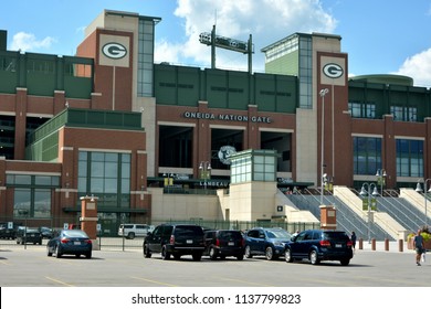 Green Bay, Wisconsin / USA - July 18, 2018: Part Of The Mostly Empty Parking Lot With The Oneida Nation Gate To The Packer's Stadium Looming In The Background. 