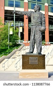 Green Bay, Wisconsin / USA - July 19, 2018: The Bronze statue of Earl L. (Curly) Lambeau in front of the stadium named for him. 