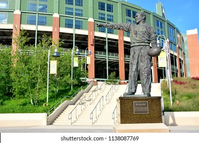 Green Bay, Wisconsin / USA - July 19, 2018: The stadium  at Green Bay with the Earl L. (Curly) Lambeau bronze statue in front pointing the way to the entrance.