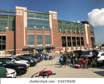 Green Bay, Wisconsin/USA- August 9th , 2018. Exterior of the Green Bay Packers stadium Lambeau Field on a game day. People tailgate in the parking lot.