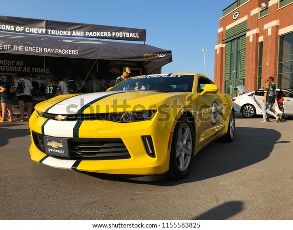 Green Bay, Wisconsin/USA. August 9th, 2018. Green\
Bay Packers themed Chevrolet Camaro in the parking lot of Lambeau\
Field on game day.