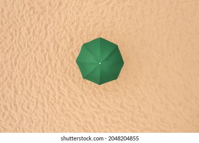 Green Beach Umbrella On Sandy Coast, Aerial View