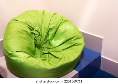 Green bean bag chair in the room close up - Powered by Shutterstock