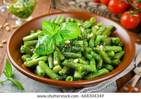 Green beans with pesto and pine nuts. Delicious balanced food concept