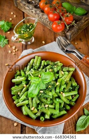 Green beans with pesto and pine nuts. Delicious balanced food concept