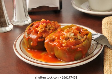 Green bell peppers stuffed with ground beef, rice and tomato sauce