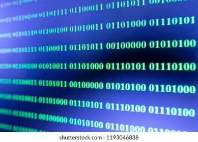 Green binary code on a black screen background