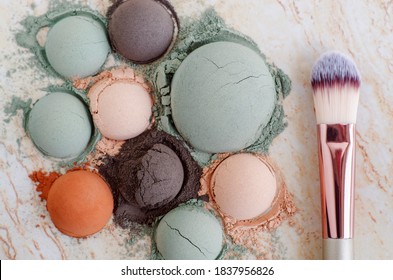 Green, Black, Red And Pink Bentonite Clay Powder And Make-up Brush. Clay Texture Close Up. Selective Focus. Top View, Copy Space. 