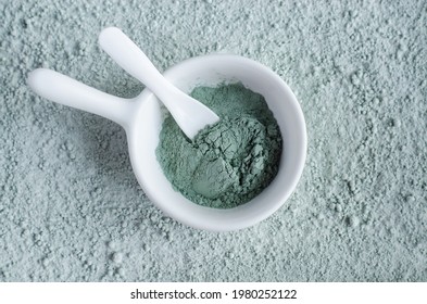 Green (blue) Bentonite Clay Powder In A Bowl. Clay Texture Close Up. Diy Face Mask And Body Wrap Recipe. Natural Beauty Treatment And Spa. Top View, Copy Space