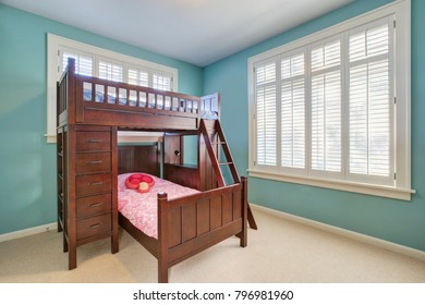 Green And Blue Kids' Room With A Brown Bunk Bed Accented With Drawers And A Built-in Ladder. Northwest, USA