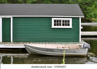 Green Boathouse And Aluminum Boat