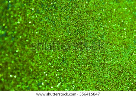 green bokeh glitter vintage lights background defocused.