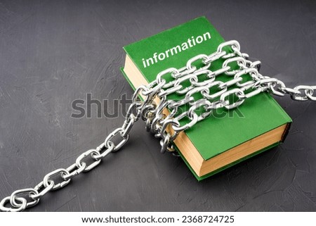 the green book has information written on it, information forbidden to everyone. chains on the book