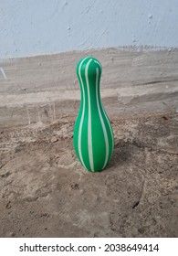 Green Bowling Pin Toy On The Floor