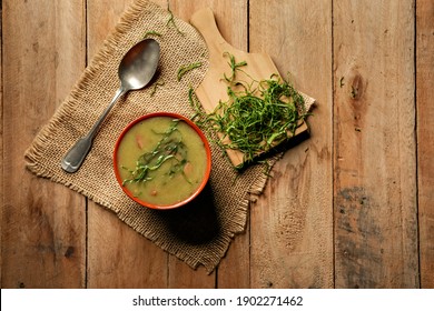 green broth with pepperoni and cabbage with top view on rustic wooden table
 - Shutterstock ID 1902271462