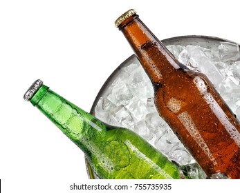 Green and brown beer bottles in a bucket with ice close up, top view