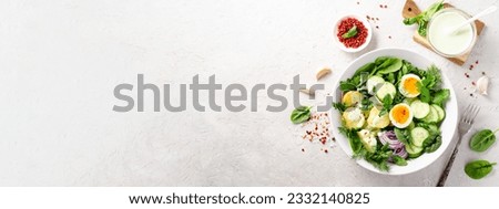 Green Buddha Bowl with Spring Herbs and Vegetables, Healthy Balanced Meal, Bowl or Salad with Young Potatoes, Cucumber, Lettuce, Egg and Herb Dressing