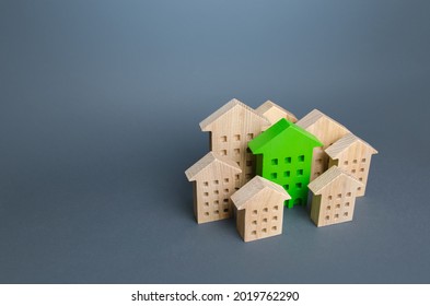 The Green Building Stands Out Among The Houses. Search For The Best Option. Ideal Property To Buy. Net Zero Carbon Neutrality. Environmentally Friendly, Energy Efficient And Zero Carbon Emissions.