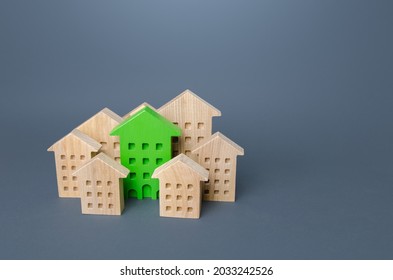 Green Building Stands Out Among The Houses. Search For The Best Option. Net Zero Carbon Neutrality. Environmentally Friendly, Energy Efficient And Zero Carbon Emissions. Ideal Property To Buy.