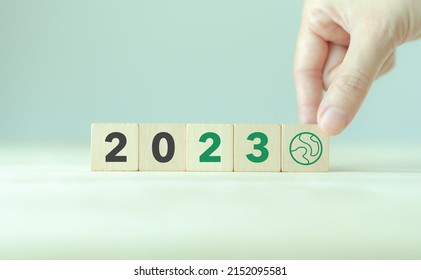 Green Business, Enviromental Sustainability In 2023. Happy New Year 2023.  Starting To New Year.  2023 Written On Wooden Cubes With Smart Background. Goals,plan,opportunity And New Business Or Life. 