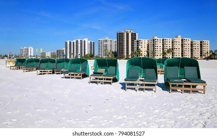 Green cabanas ready to be rented in front of Fort Myers Beach hotels and time share condos.