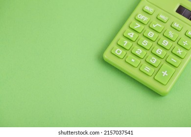 Green calculator on Green background. Copy space. Environmental, Social, Corporate Governance. Green Credit - Shutterstock ID 2157037541
