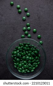 Green Candy Coated Chocolate Button Sprinkles In A Bowl On Dark Slate - MMs, Smarties, Sprinkles