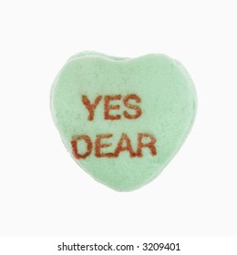 Green Candy Heart That Reads Yes Dear Against White Background.