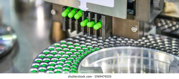 Green capsule medicine pill production line, Industrial pharmaceutical concept