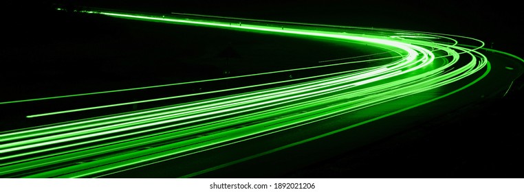 green car lights at night. long exposure - Shutterstock ID 1892021206