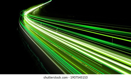 Green Car Lights At Night. Long Exposure