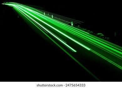 green car lights at night. long exposure - Powered by Shutterstock
