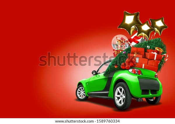 Green car on red background. Christmas tree,\
present boxes, balloons in form of golden stars, snow globe on\
roof. Collage. Copy space,\
close-up.