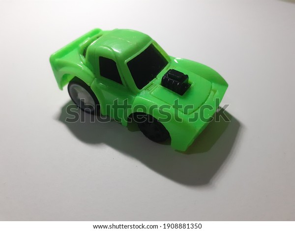 Green car toy in\
frame