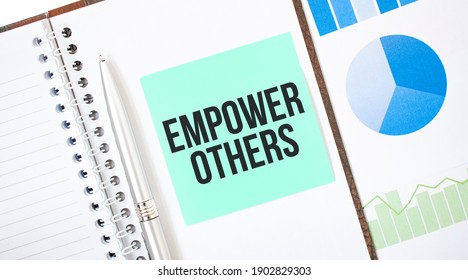 Green Card On The White Notepad. Text Empower Others. Business Concept