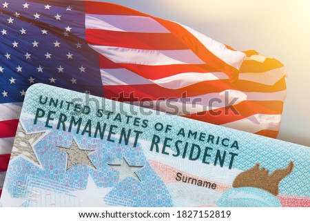 Green Card US Permanent resident card USA. Electronic Diversity Visa Lottery DV-2022 DV Lottery Results. United States of America. American flag on background. 