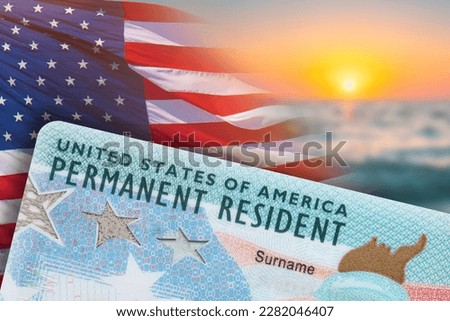 Green Card. US Permanent resident card. Immigration to USA. Electronic Diversity Visa Lottery DV-2024 DV Lottery Results. United States of America. American dream. Sunset, American flag on background