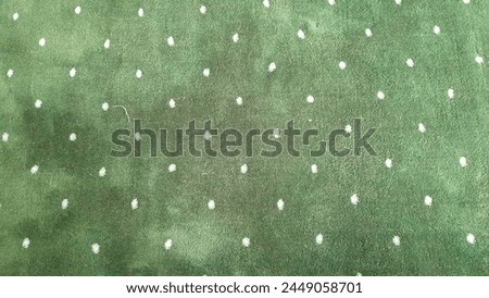 Green carpet with white polkadot motive