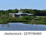Green Cay Nature Center and Wetlands visitor pavilion in Boynton Beach, Florida on clear cloudless sunny morning..