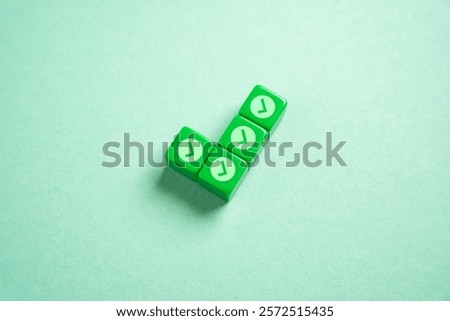 Green checkmark made of blocks with small checkmarks. Divide the work into parts for its easy execution. Concept of planning and dividing the work.