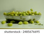 Green chickpeas in the pod with green leaves and flower, isolated on white background. Cicer arietinum. Clipping path. 