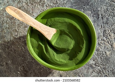 Green Chlorella Algae Powder In A Bowl On A Table