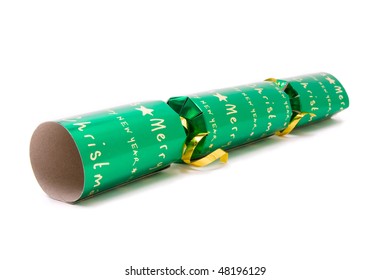 Green Christmas Cracker Shot From Low Viewpoint With Shallow Focus Against White Background.