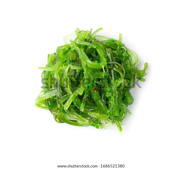 Green\
Chuka Seaweed Salad Isolated on White Background Top View. Wakame\
Sea Kelp Salat, Chukka Sea Weed, Healthy Algae\
Food