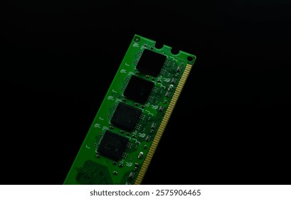 Green circuit board with black chips on black background electronic component computer part detail technology design element