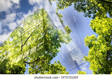 green city - double exposure of lush green forest and modern skyscrapers windows	 - Shutterstock ID 1975731359